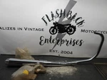 1977-80 Kawasaki Nos Exhaust Pipe Muffler 18001-1003 #12 2330. Fixed Price $595.00.