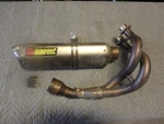 Akrapovic Race Line 2 Into 1 Full System Titanium / Carbon Can - Damaged. Fixed Price $299.99.